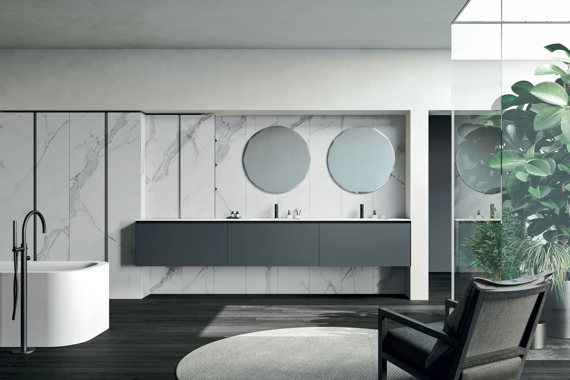 Rexa Design Moode Waschtischanlage mit zwei runden Spiegeln vor Marmorwand und freistehender Badewanne